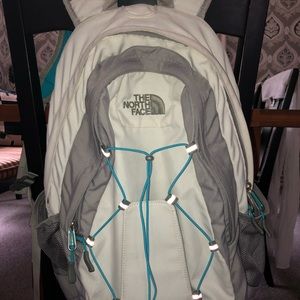 North face white and blue backpack